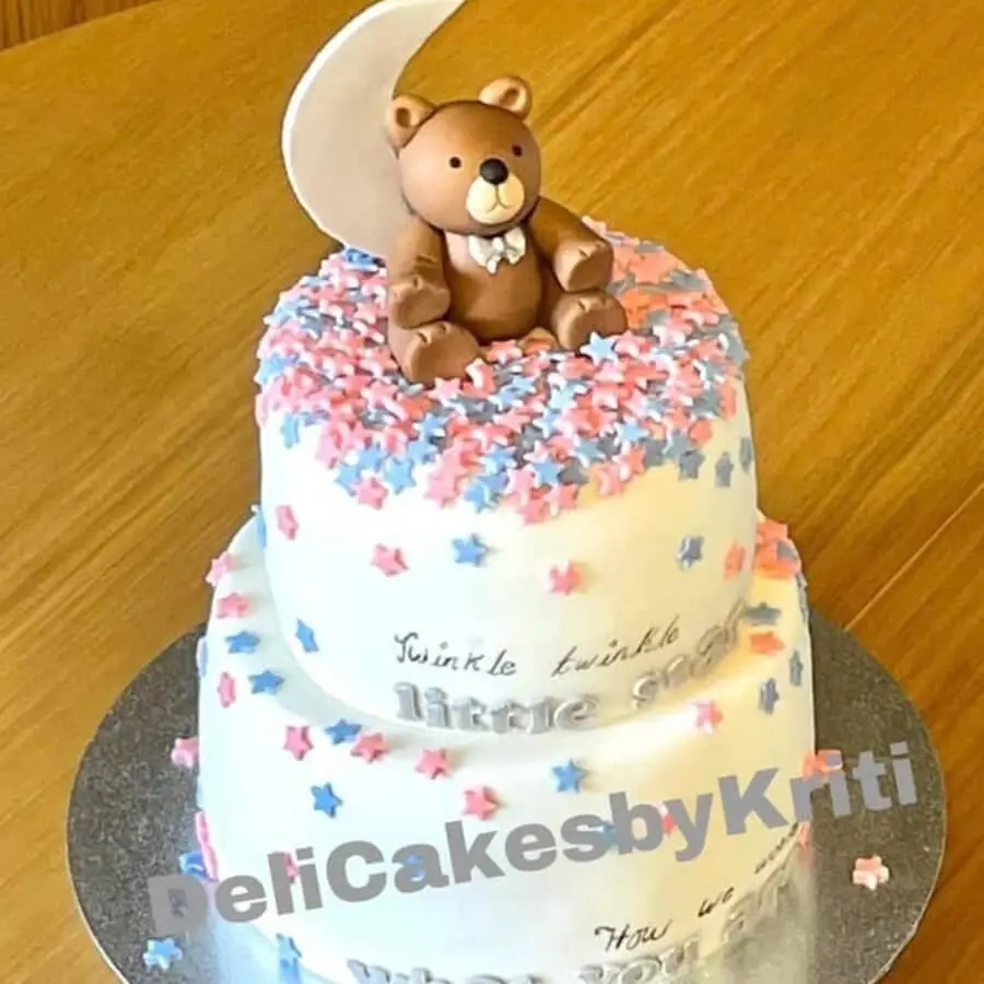 Baby Shower cake with a bear sitting on it