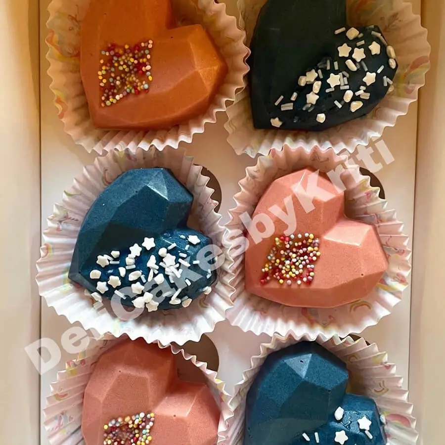 Colored heart shaped cake pops.