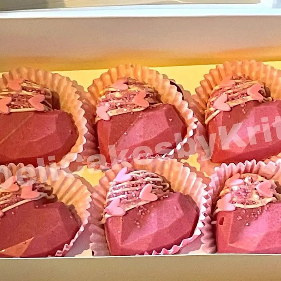 Pink heart shaped cake pops.